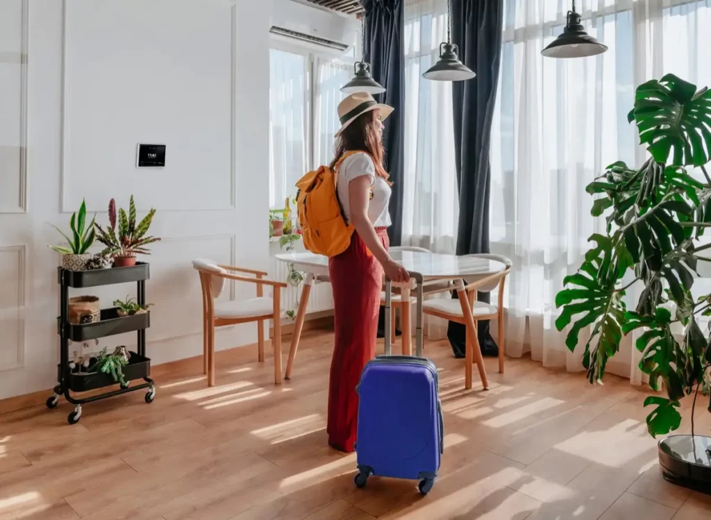 woman arriving at a short-term property managed by The Upgrade Authority in Bristol